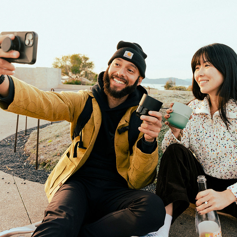 bring-your-own-party-kit-tumblers-and-cocktails-k6 8oz_rise_lowball_black_iceberg_couple_selfie_city_square.jpg
